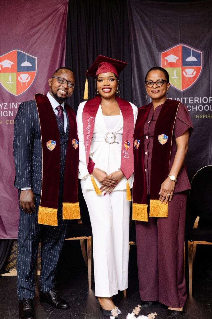 Dreyz graduate with faculty at certification